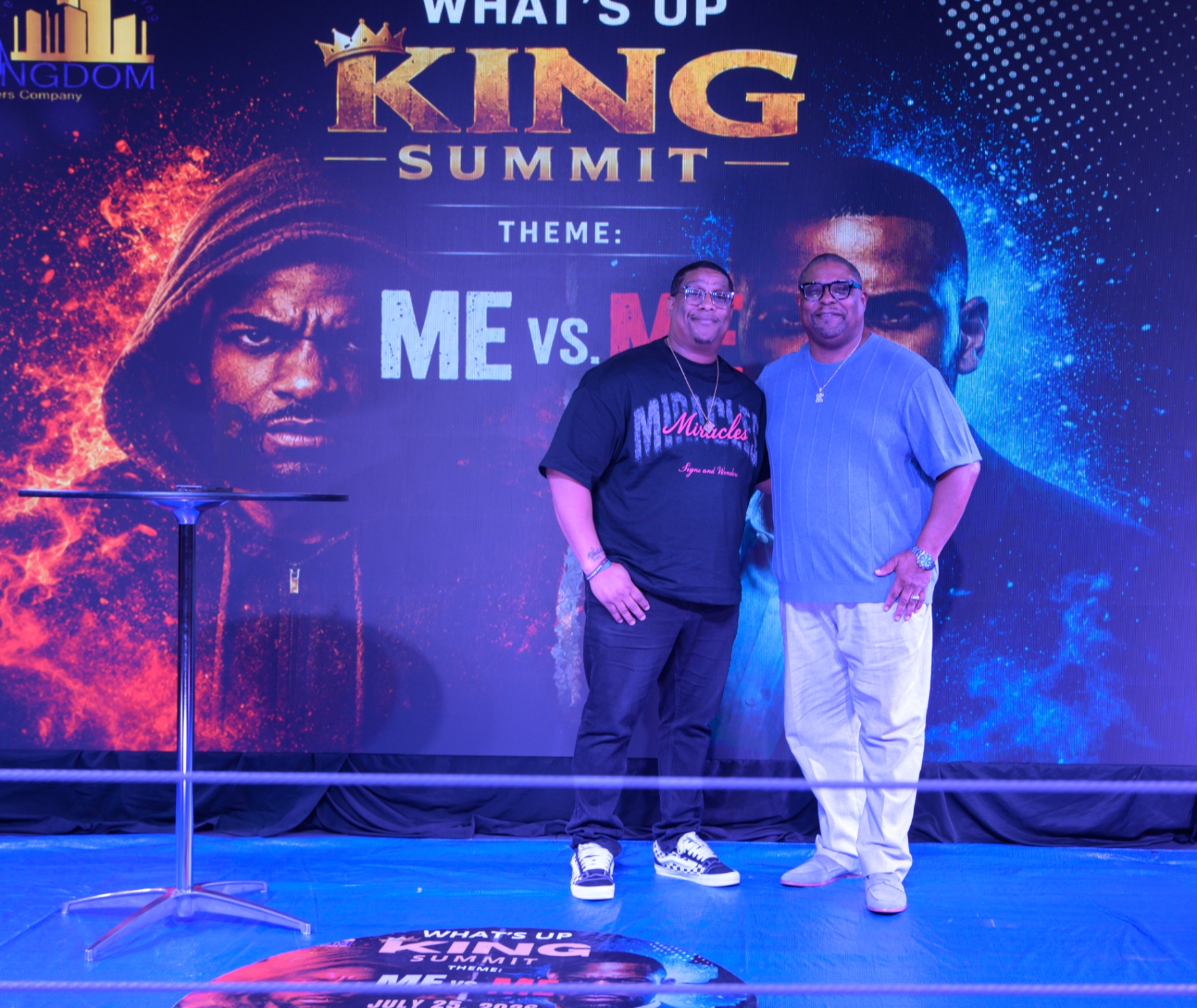 Two participants in conversation on the summit stage